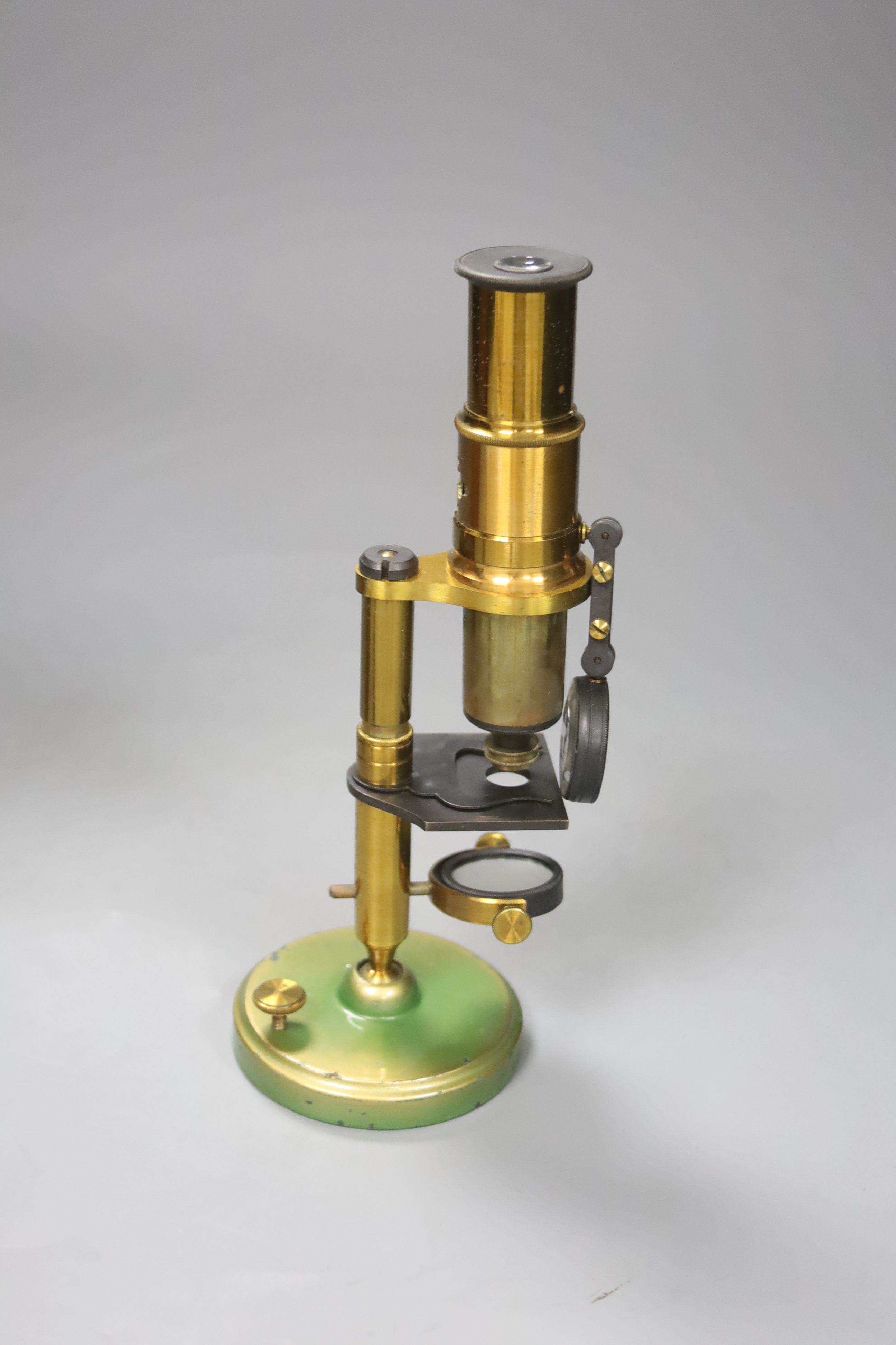 A brass monocular microscope, cased